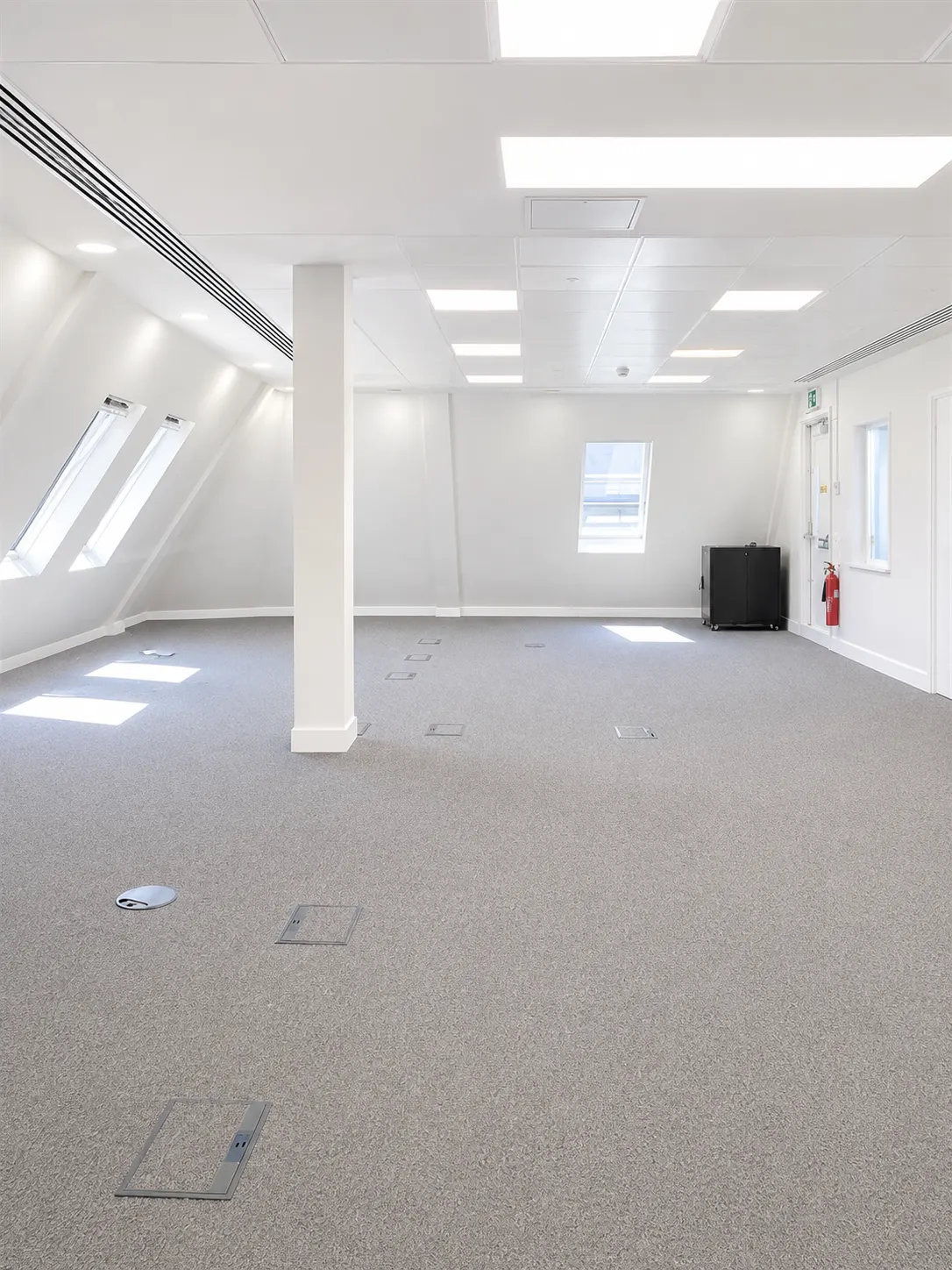 Sixth floor at 16-18 New Bridge Street today, top floor Cat A space with pitched dormer windows
