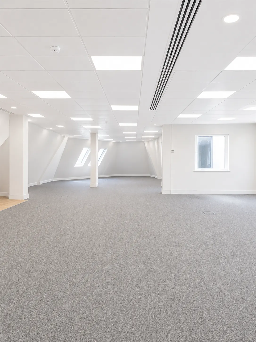 Sixth floor at 16-18 New Bridge Street today, open plan Cat A space with new lighting and carpet