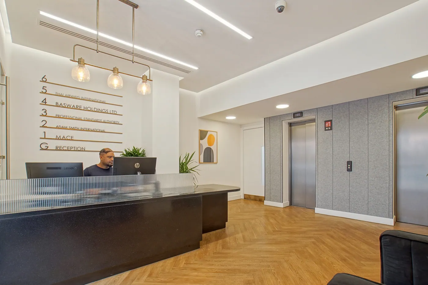 Reception desk and passenger lifts at 16-18 New Bridge Street